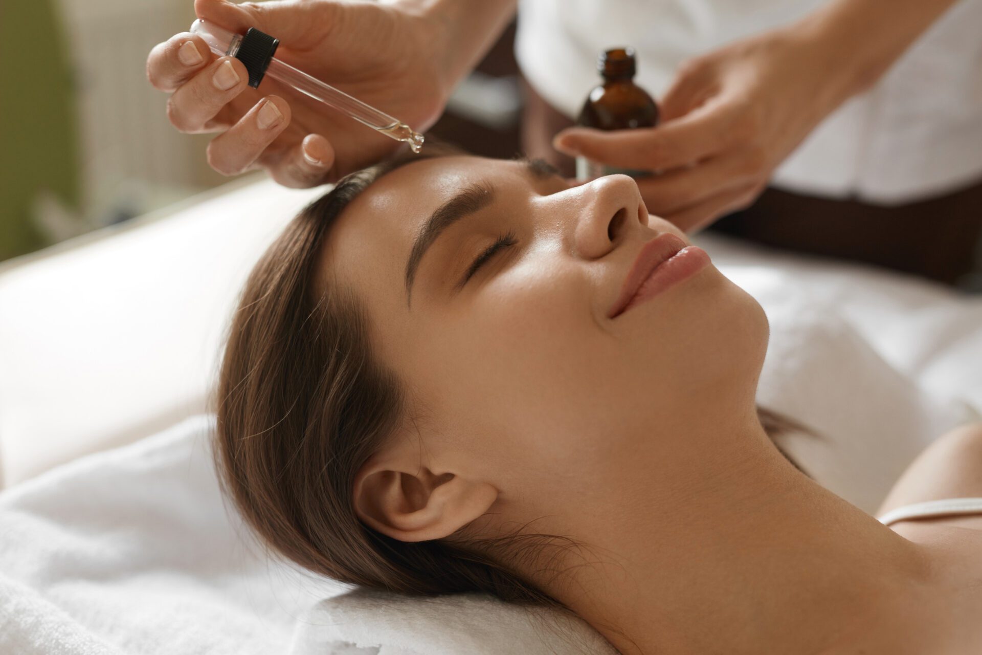 Face Skin Care. Woman Receiving Serum Treatment In Beauty Salon Face Skin Care. Woman Receiving Serum Treatment In Beauty Salon
